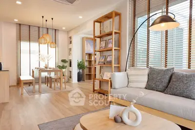 Modern living room with stylish decor and natural light, featuring wooden furniture and cozy ambiance.