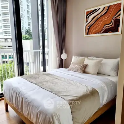 Modern bedroom with large window and stylish decor in urban apartment