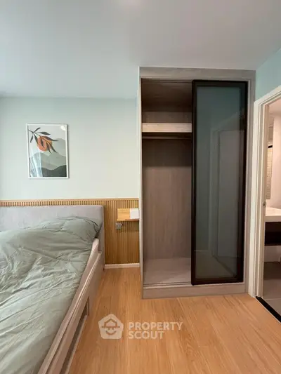 Modern bedroom with stylish wardrobe and cozy bed in a chic apartment