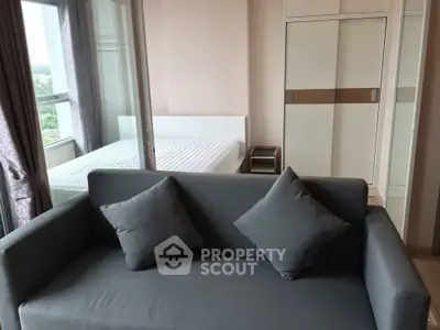 Modern apartment interior with cozy living room and bedroom view