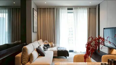 Elegant modern living room with large windows and stylish decor