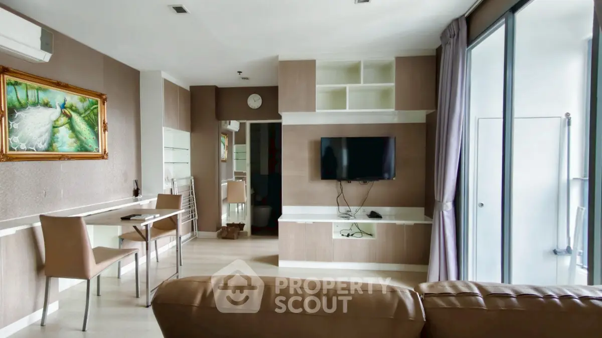 Spacious modern living room with wall-mounted TV and elegant decor