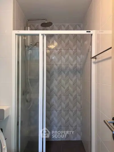 Modern bathroom with stylish shower and patterned tiles