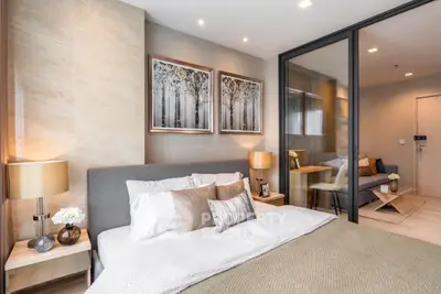 Modern bedroom with elegant decor and cozy ambiance in luxury apartment