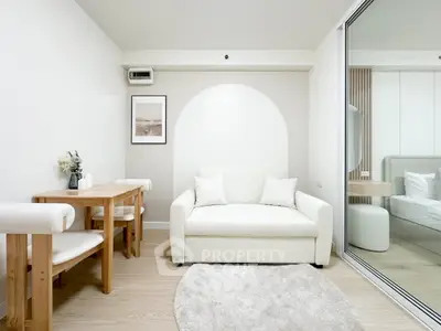 Modern minimalist living room with white sofa and wooden dining set