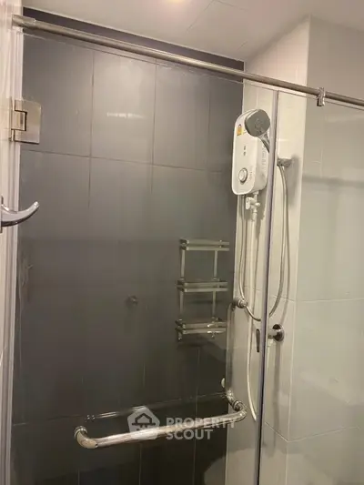 Modern bathroom with sleek shower enclosure and water heater