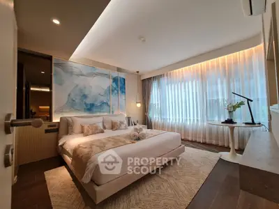 Luxurious bedroom with elegant decor and large window for natural light