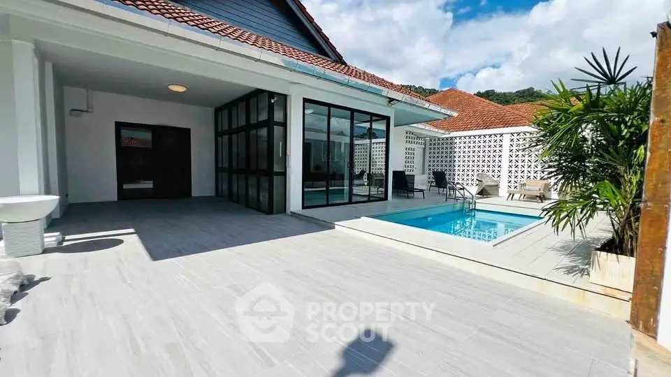 Luxurious villa with private pool and spacious patio, perfect for relaxation and entertaining.