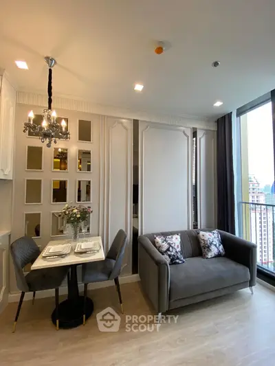 Modern living room with elegant decor and city view balcony in luxury apartment.