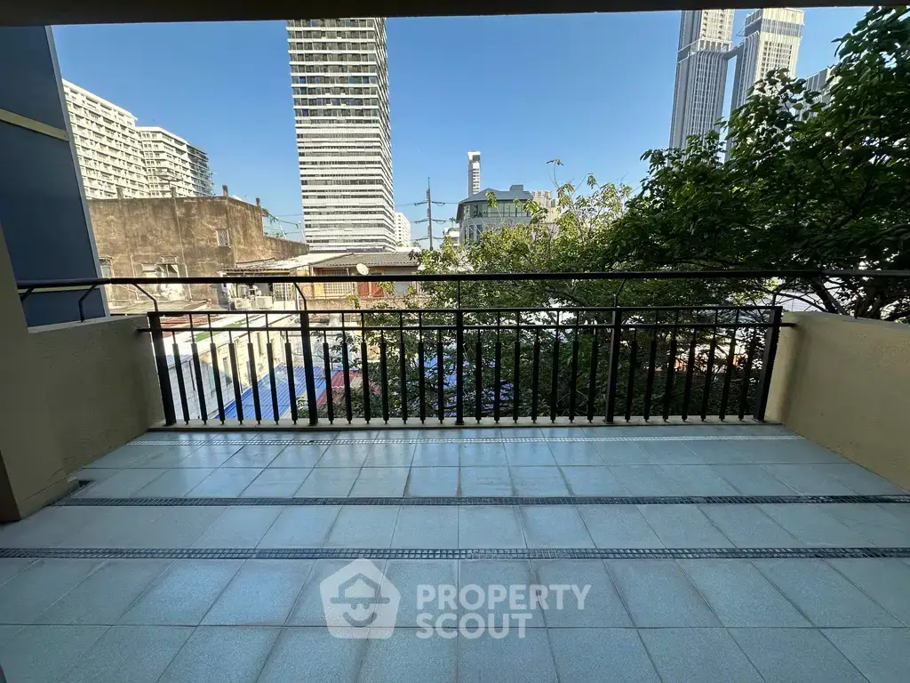 Spacious balcony with city view, perfect for relaxation and enjoying urban scenery.