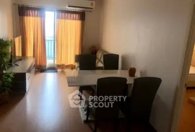 Spacious living room with balcony access and elegant dining area in modern apartment.