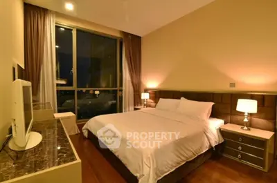 Luxurious bedroom with elegant decor and large window view