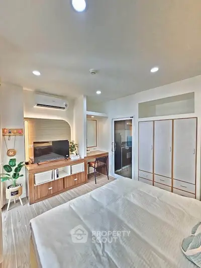 Modern bedroom with stylish furniture and natural light