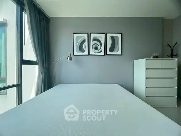 Modern minimalist bedroom with large window and stylish decor