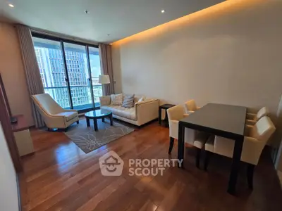Spacious living room with modern furniture and city view, perfect for urban living.