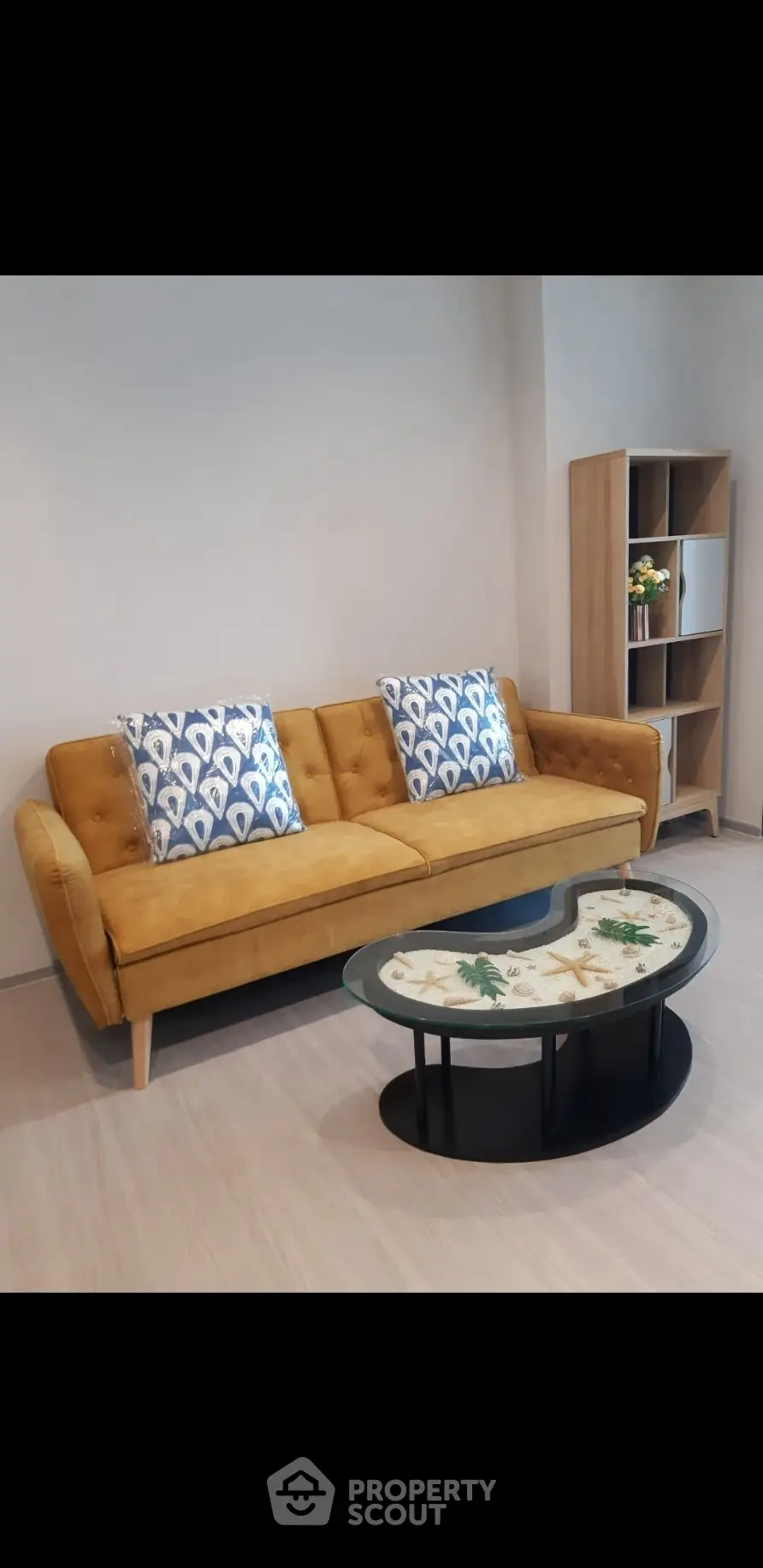Stylish living room with mustard sofa and modern coffee table