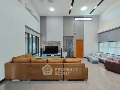 Spacious modern living room with large sofa and sleek design