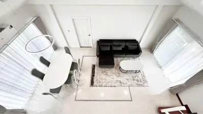 Spacious modern living room with elegant dining area and stylish furniture