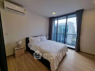 Modern bedroom with balcony view in a stylish apartment