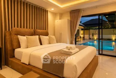 Luxurious bedroom with pool view, elegant decor, and ambient lighting for a serene retreat.