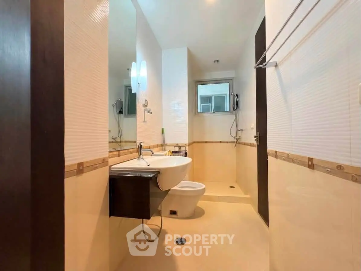 Modern bathroom with sleek fixtures and spacious shower area