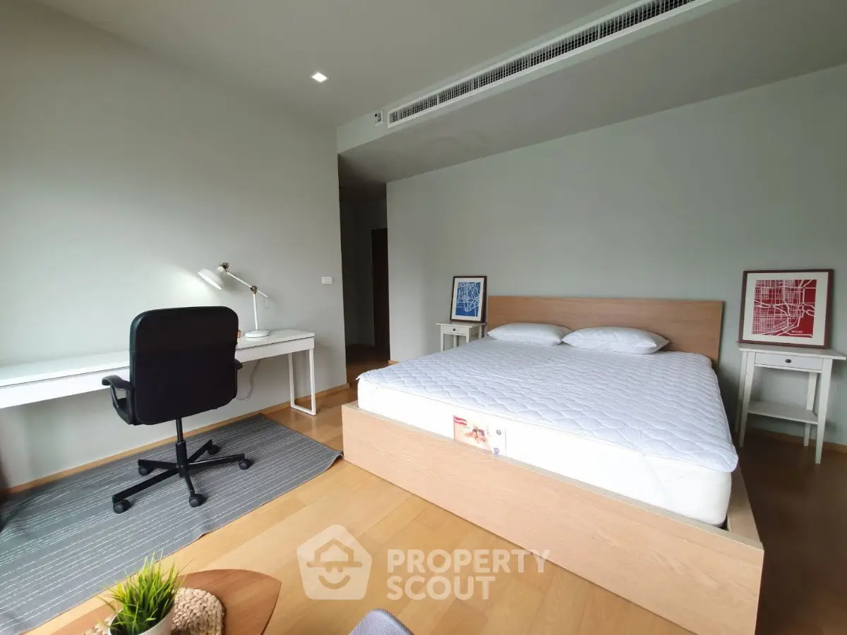 Modern bedroom with study area, featuring a sleek desk and comfortable bed, perfect for productivity and relaxation.