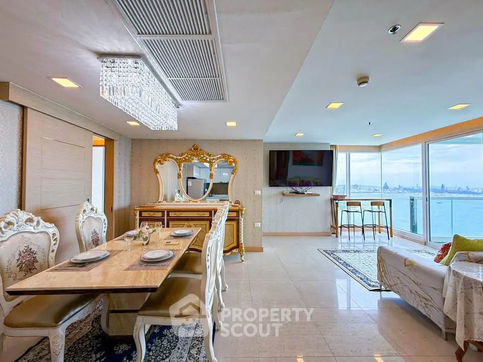 Luxurious living room with elegant dining area and stunning ocean view