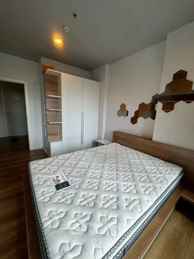 Modern bedroom with stylish decor and comfortable mattress in a contemporary apartment.