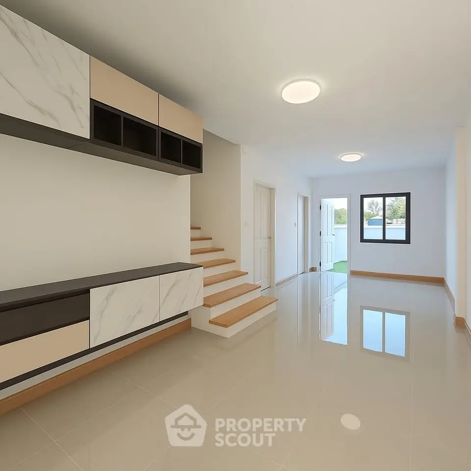 Spacious modern living room with sleek storage and natural light