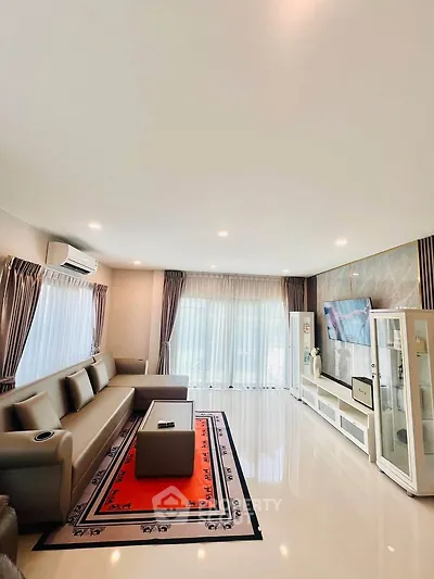Spacious modern living room with elegant decor and ample natural light