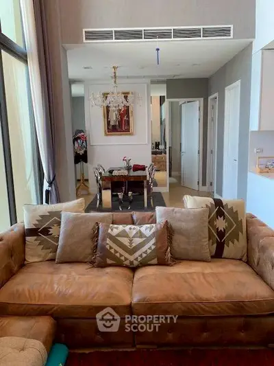 Luxurious living room with elegant decor and spacious layout in modern apartment.
