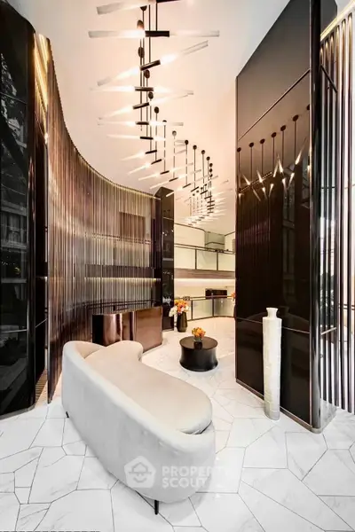 Luxurious modern living room with elegant lighting and sleek design elements.