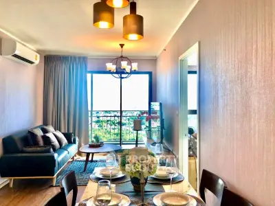 Stylish living room with modern decor and balcony view in a contemporary apartment.