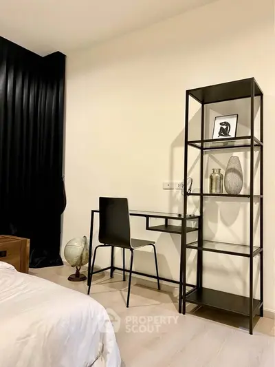 Modern bedroom with sleek desk and shelving, perfect for a stylish home office setup.
