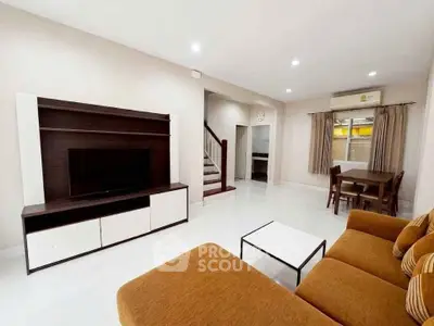 Spacious living room with modern furniture and open layout, perfect for family gatherings.