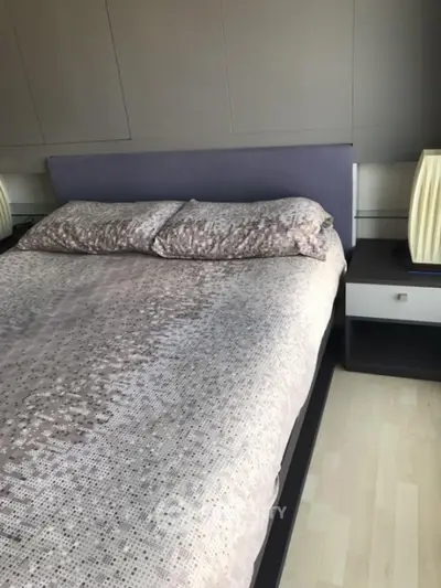 Modern bedroom with stylish bed and elegant decor, perfect for a cozy retreat.
