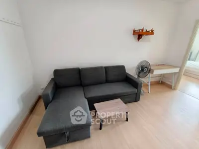 Modern living room with sleek gray sofa and minimalist decor