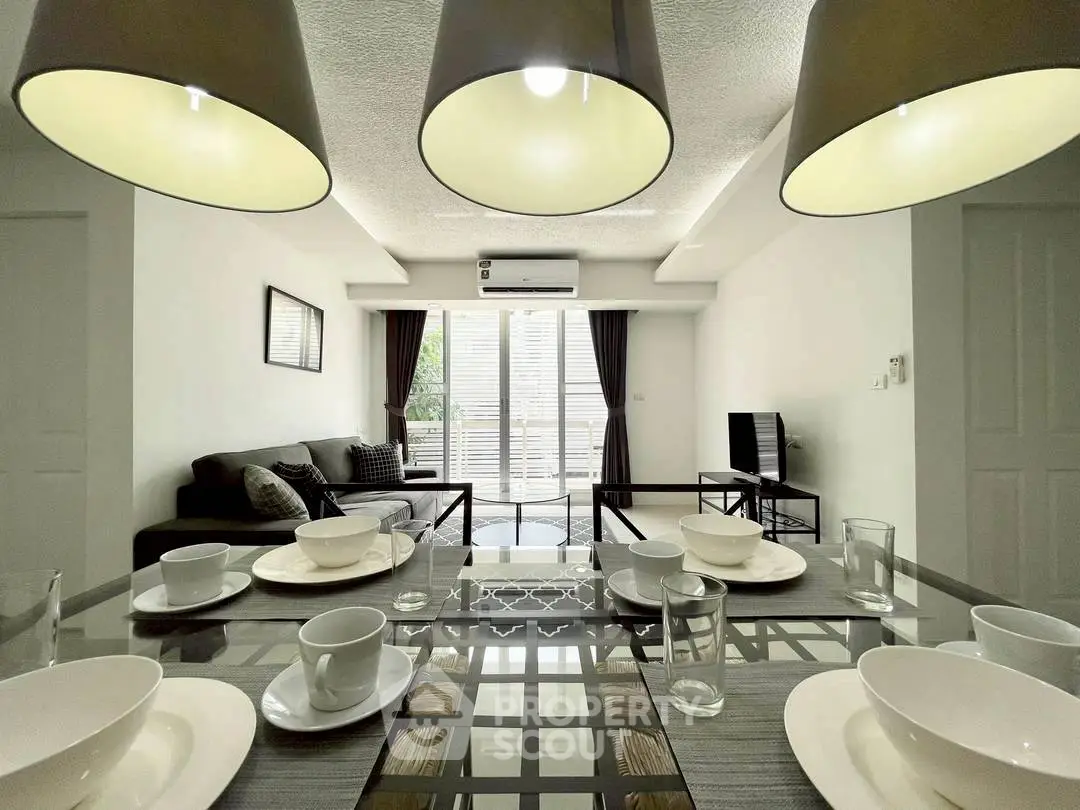 Modern living room with stylish dining area and natural light