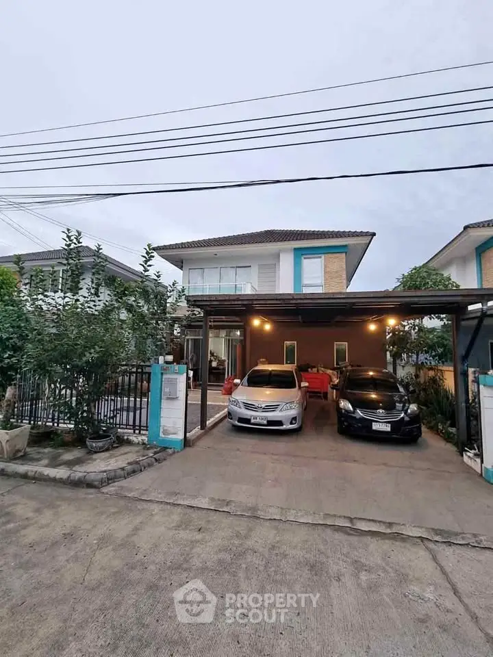 Charming suburban home with covered parking and lush greenery