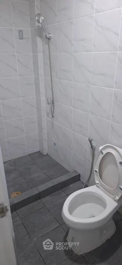 Modern bathroom with sleek tile design and open shower area