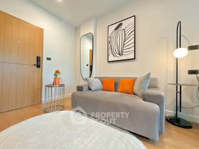 Spacious living room with modern decor and large mirror, perfect for relaxation and entertaining.