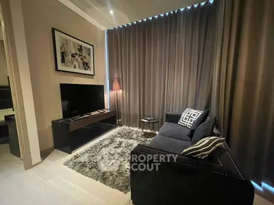 Cozy living room with plush sofa, stylish decor, and ambient lighting for a relaxing atmosphere.