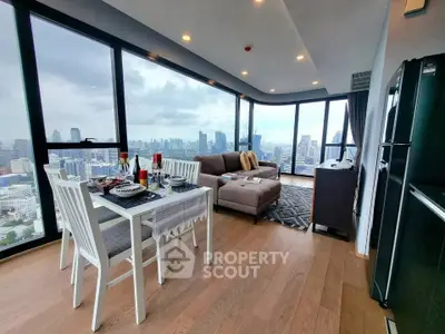 Stunning high-rise living room with panoramic city views and modern decor.