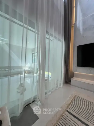 Luxurious modern living room with high ceilings and elegant decor