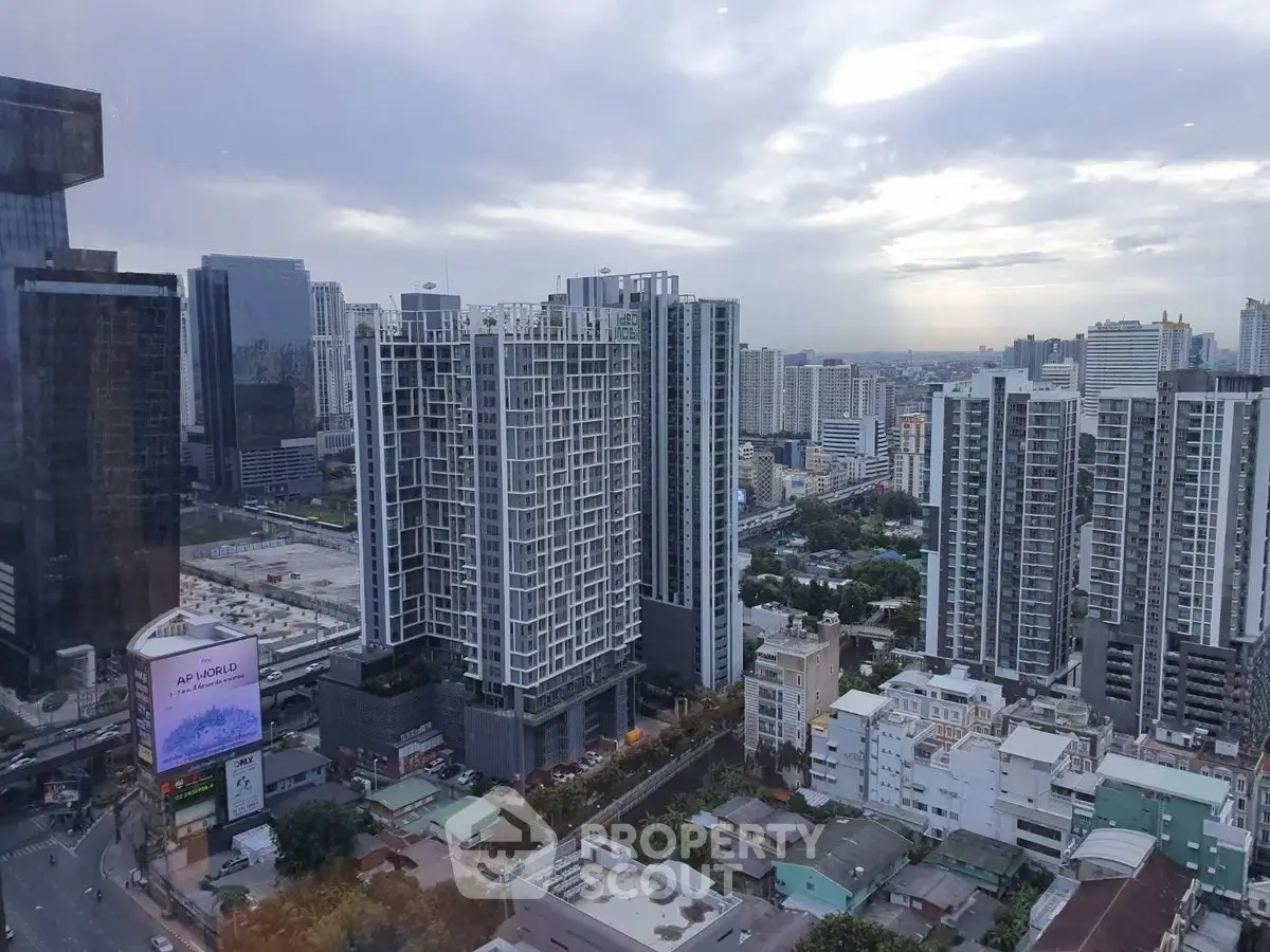 Stunning cityscape view showcasing modern high-rise buildings under a cloudy sky.
