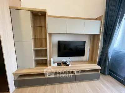 Modern living room with sleek entertainment unit and mounted TV