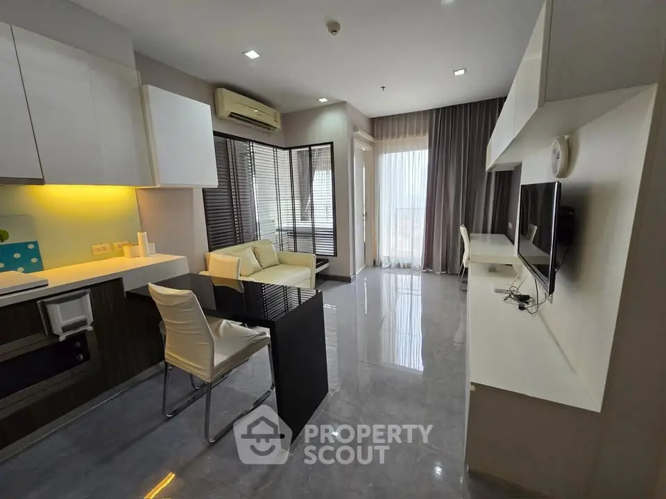 Modern living room with sleek design, open layout, and natural light, featuring stylish furniture and contemporary decor.
