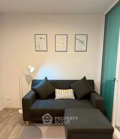 Modern living room with stylish sofa and decor, perfect for cozy relaxation.