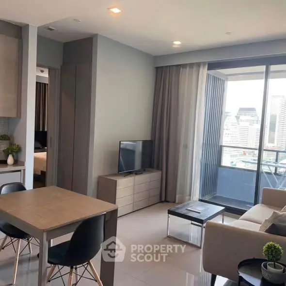 Modern living room with city view and stylish furniture in high-rise apartment.