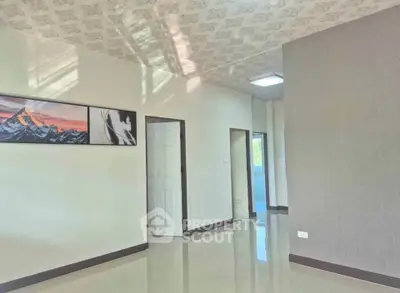 Spacious modern interior with elegant wall art and glossy flooring
